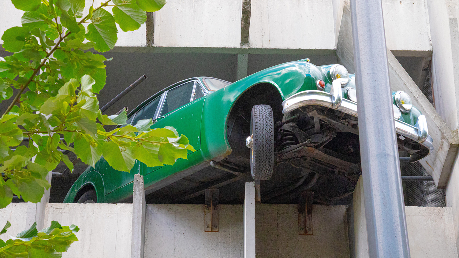 car hanging out of a car park